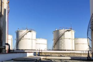 View of multiple white oil and gas pressure vessels