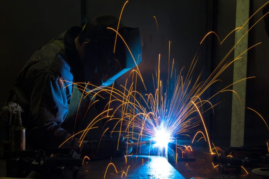 Close up view of a welder welding pieces of metal together